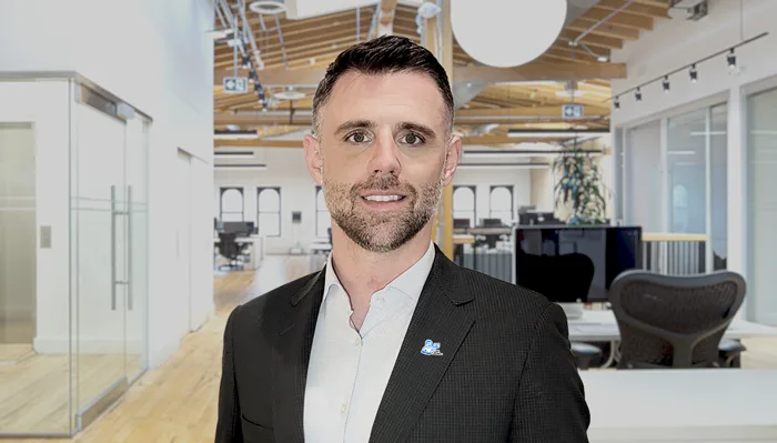 Picture of Matt in an office, smiling